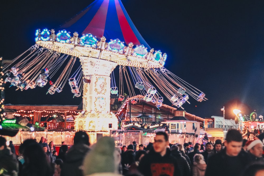 people walking on amusement park during nighttime