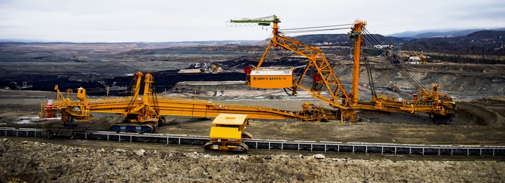 orange heavy duty trucks during daytime