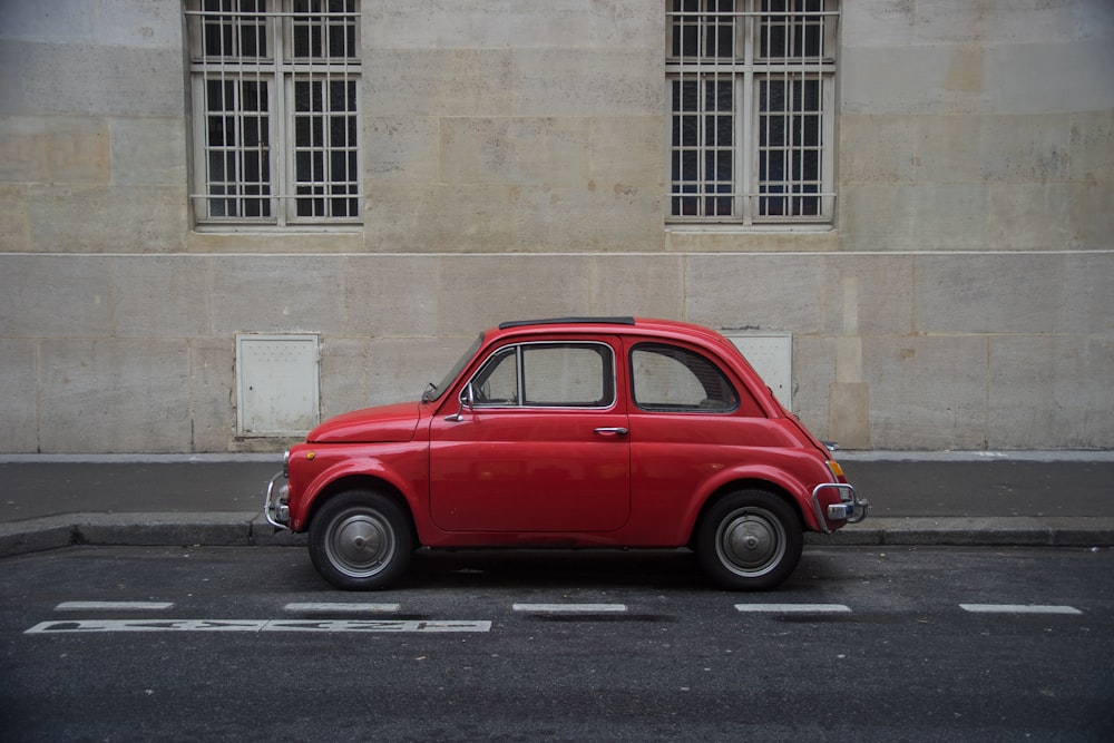 red Volkswagen Beetle hatchback on road