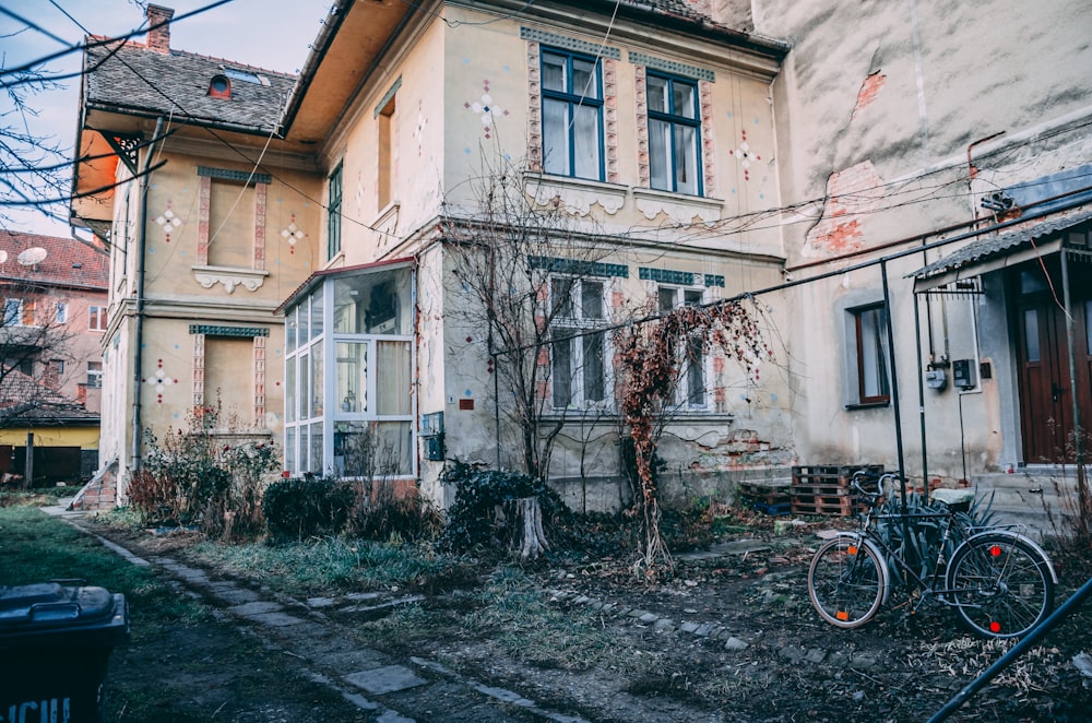 bicycle parked near house during daytime