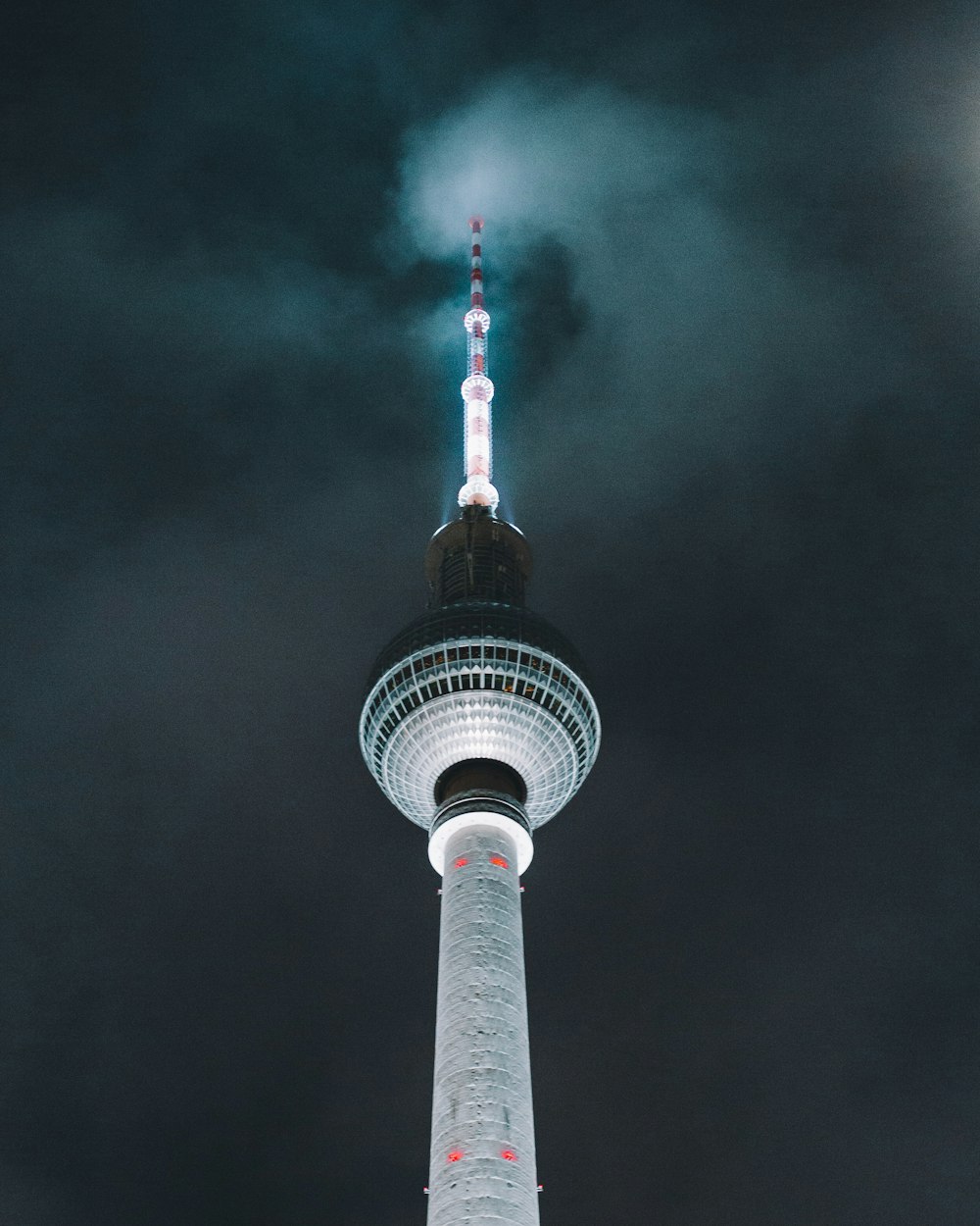 gray concrete tower under white cloudy sky