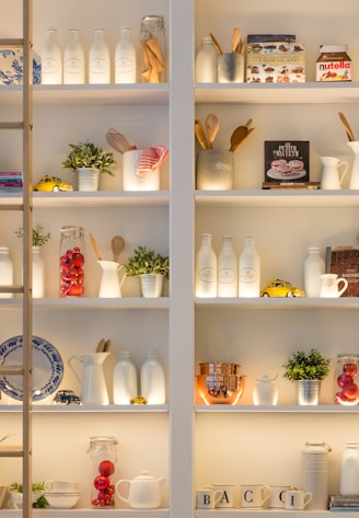 white ceramic bottles on shelf