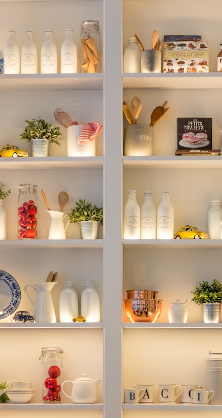 white ceramic bottles on shelf