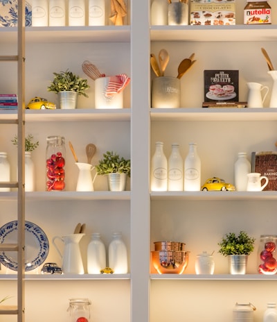 white ceramic bottles on shelf