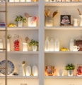 white ceramic bottles on shelf