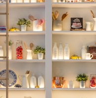 white ceramic bottles on shelf