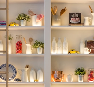 white ceramic bottles on shelf