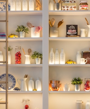 white ceramic bottles on shelf