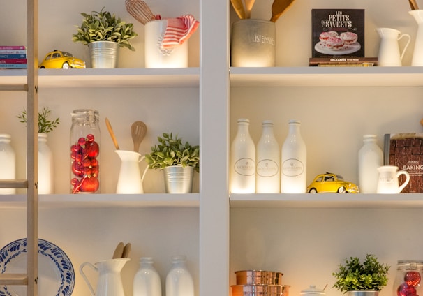 white ceramic bottles on shelf