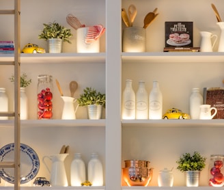 white ceramic bottles on shelf