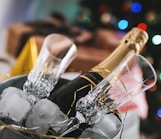 champagne bottle and glass in bucket