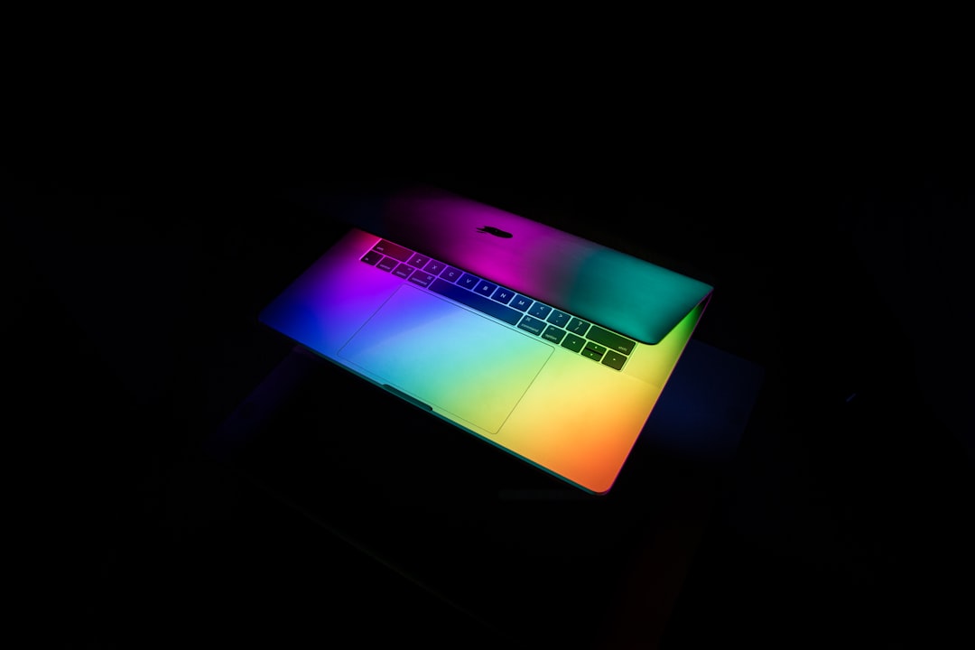 gray laptop computer, This rainbow gradient created in Photoshop is illuminating the Macbook Pro in an interesting way. Inspired by the colors, I painted a bit of light over the top with my smartphone and an RGB color app. This is the stuff that will always keep me up until 1am.