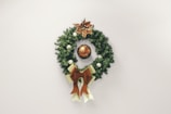 An elegant holiday wreath adorned with festive ornaments.