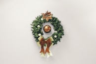 A festive Christmas wreath adorned with seasonal decorations.