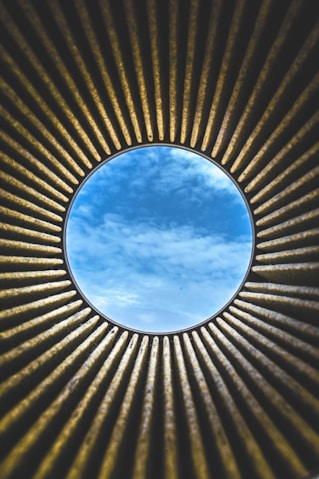 round blue and white hole under blue and white sky