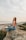 woman sitting on rock during daytime