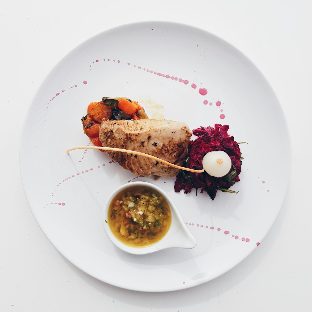  flat lay photography of cooked meat and sauce platter plate