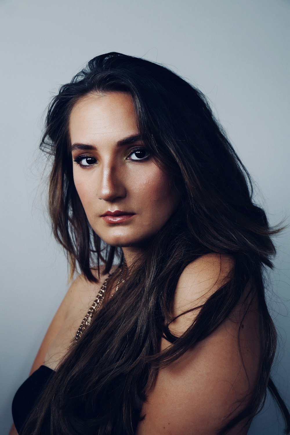 woman wearing necklace and tube top