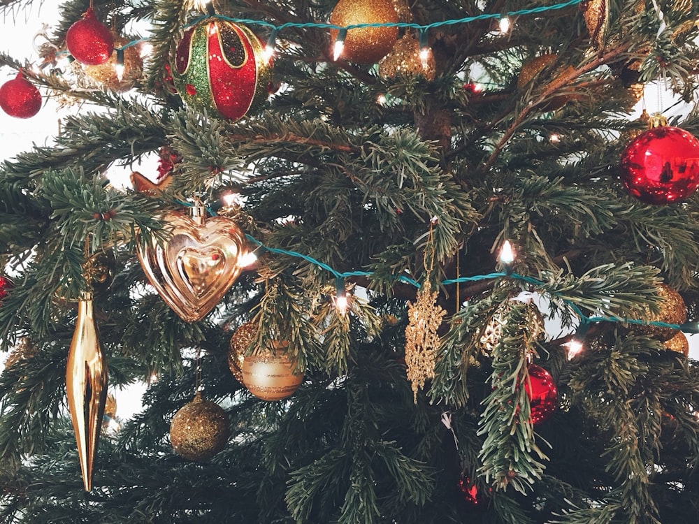 a close up of a christmas tree with ornaments