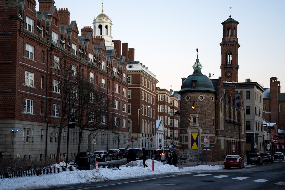 a city street with cars parked on the side of the road