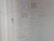 A wall covered in various handwritten motivational quotes and notes. Some quotes are attributed to notable personalities and focus on themes like persistence, success, and self-belief. There are drawings and scribbles, including diagrams and small notes, emphasizing hard work and dedication.