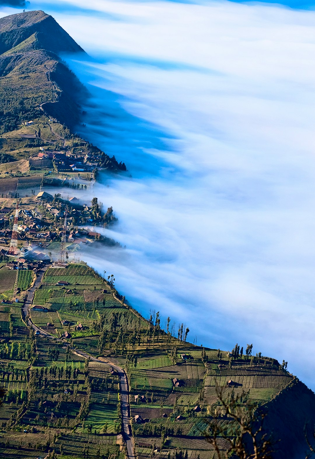 green mountains covered with fog