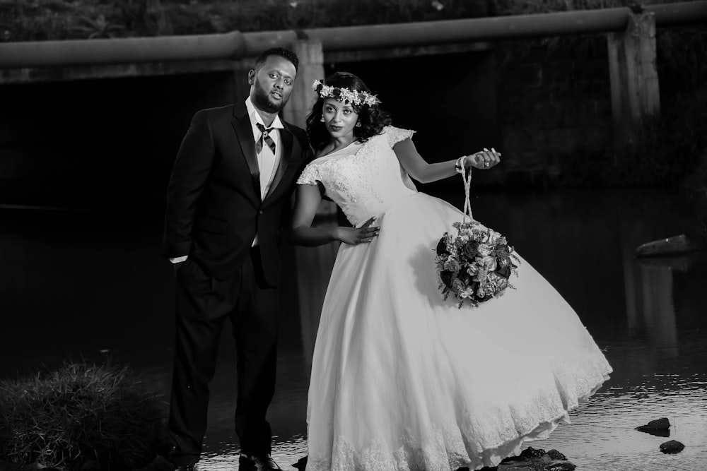 bride and groom taking group picture