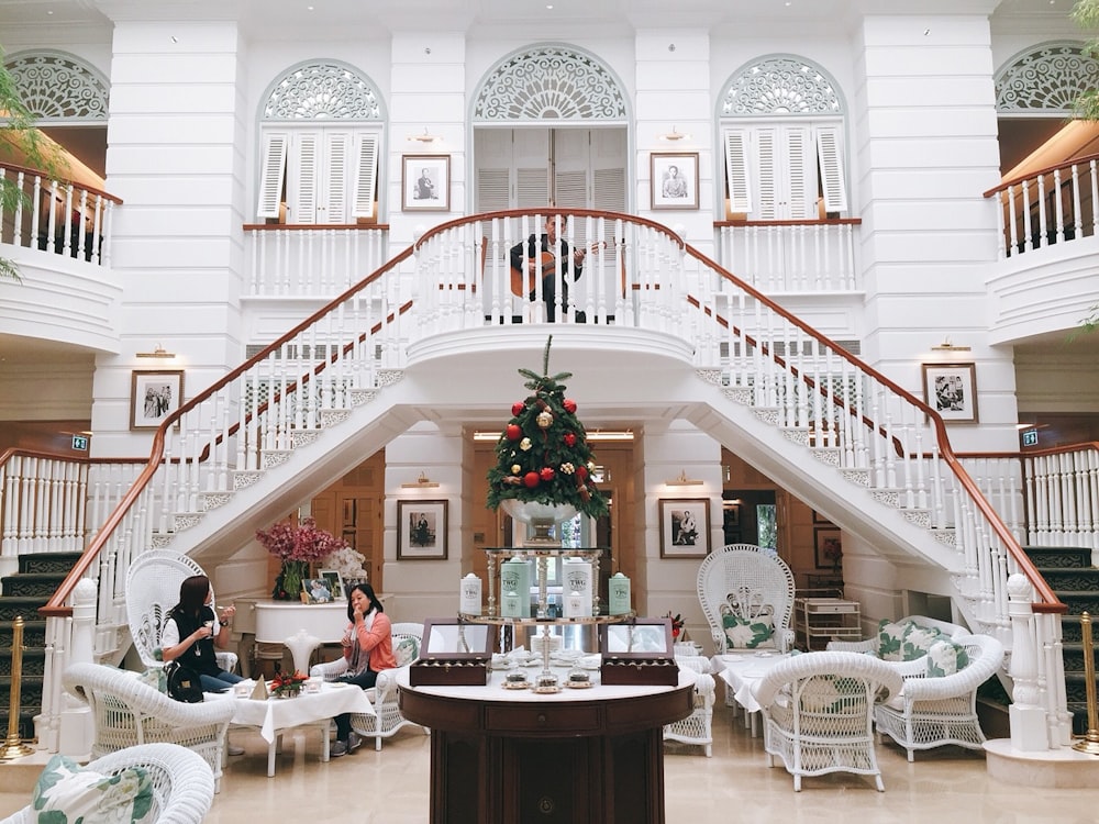 photo of house interior with two women sitting on chairs