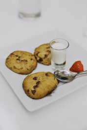 three baked cookies on plate