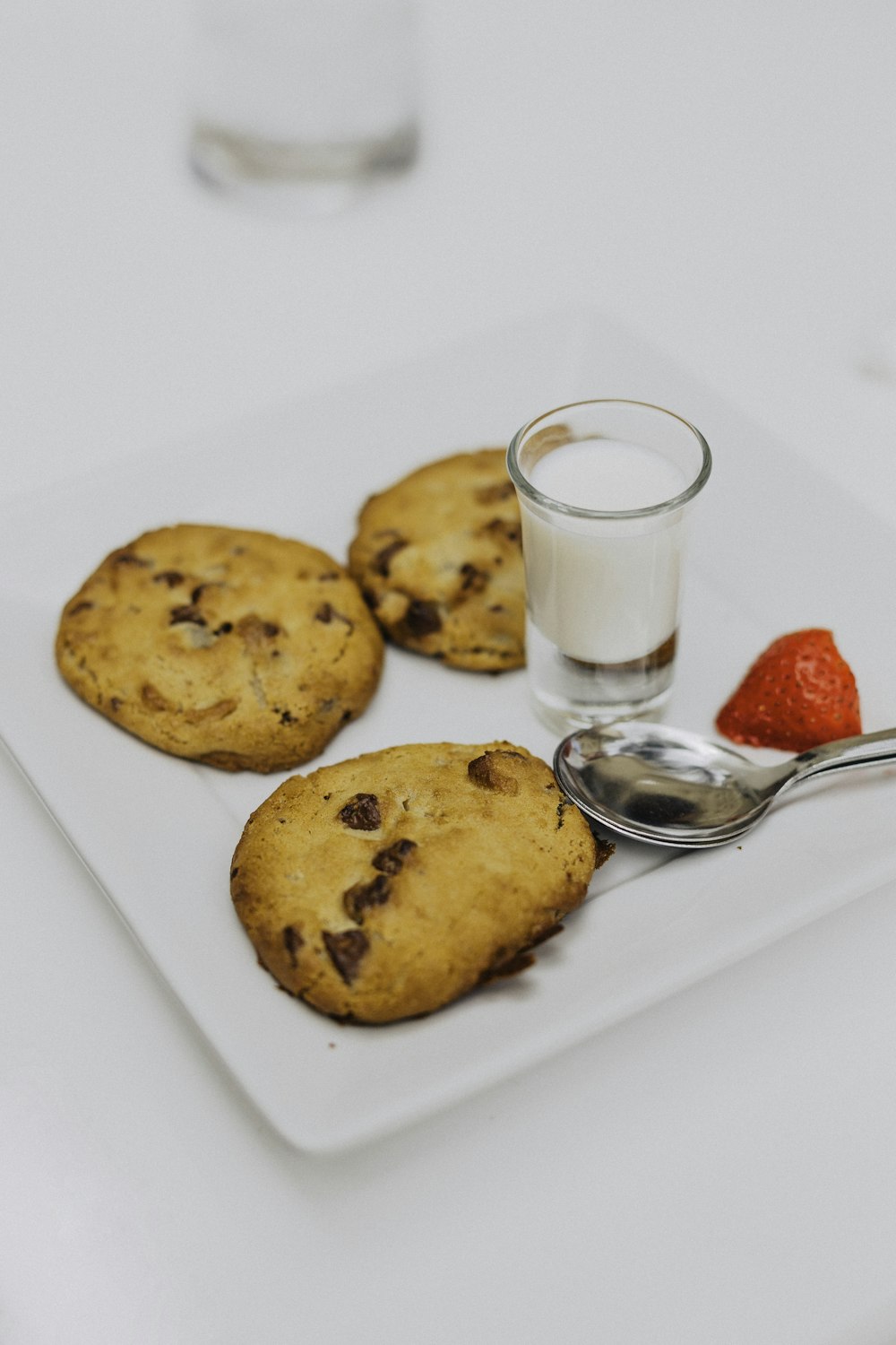 three baked cookies on plate