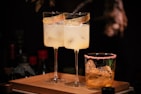 liquor filled wine glasses and rock glass
