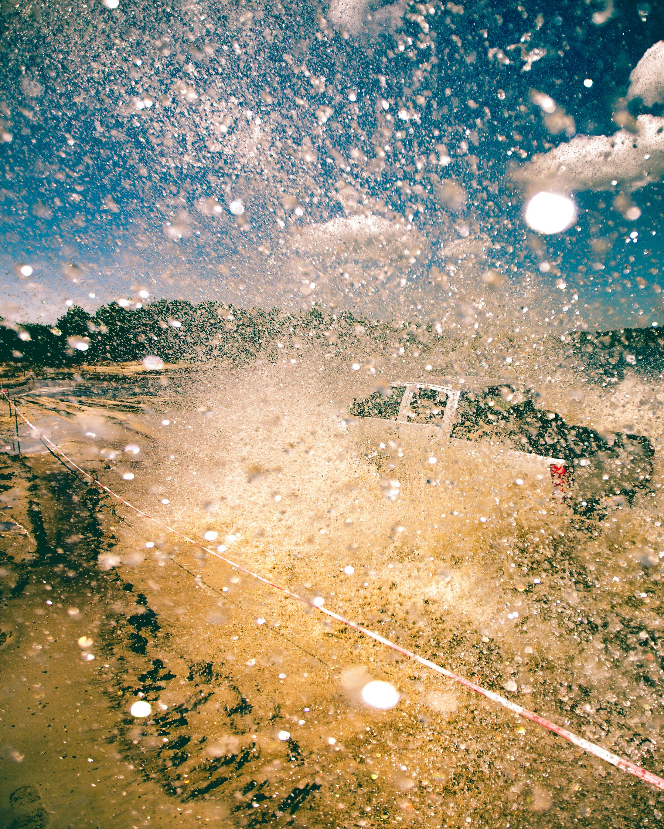 water sprinkles from pickup truck