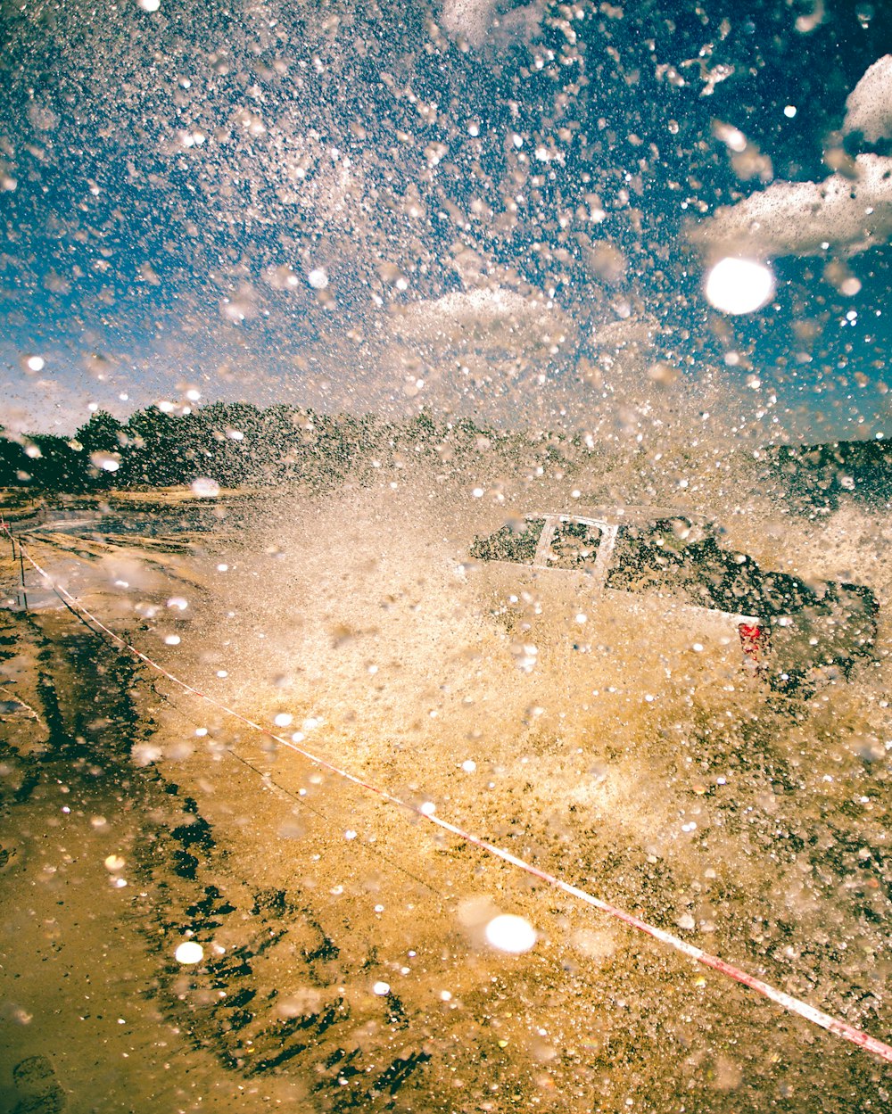 water sprinkles from pickup truck