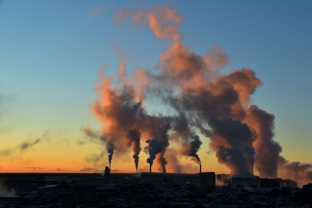 silhouette of factory during sunset