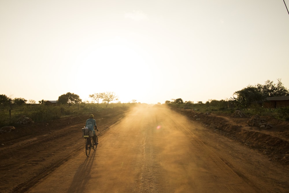 person riding bicycle on rod