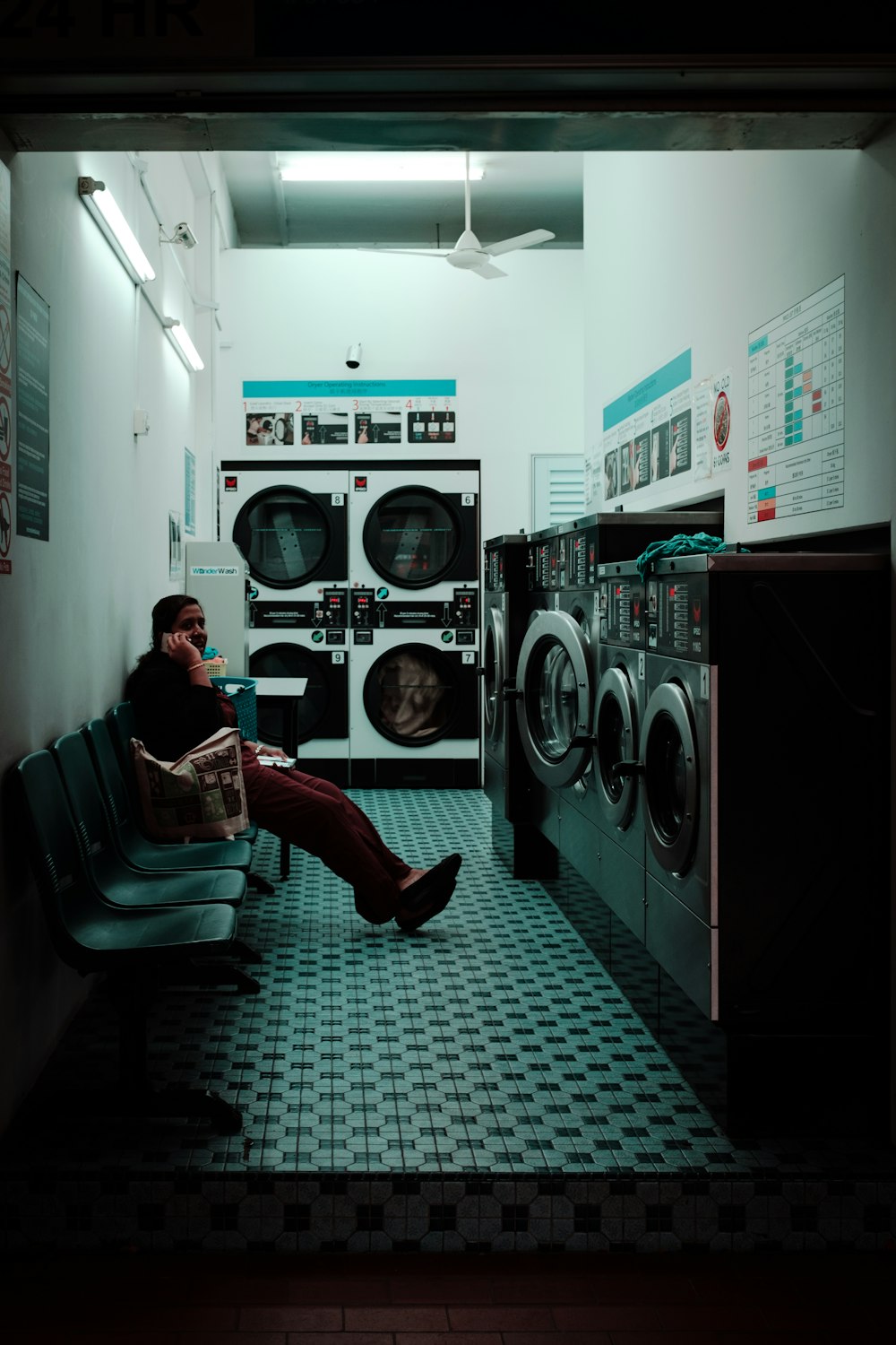 woman sitting inside laundry shop