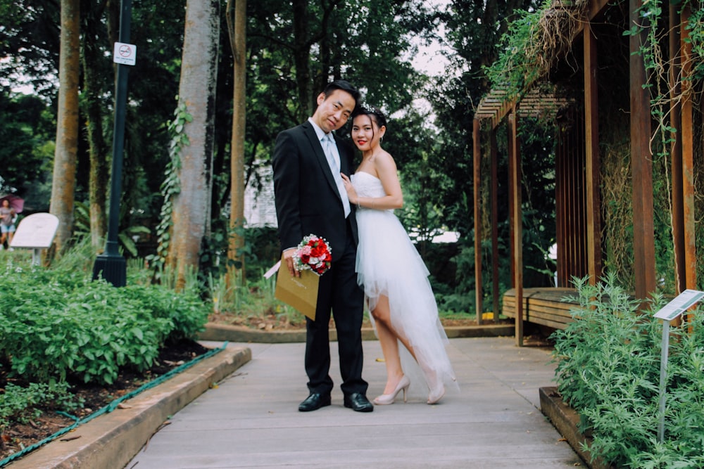 bride and groom taking photo during daytime