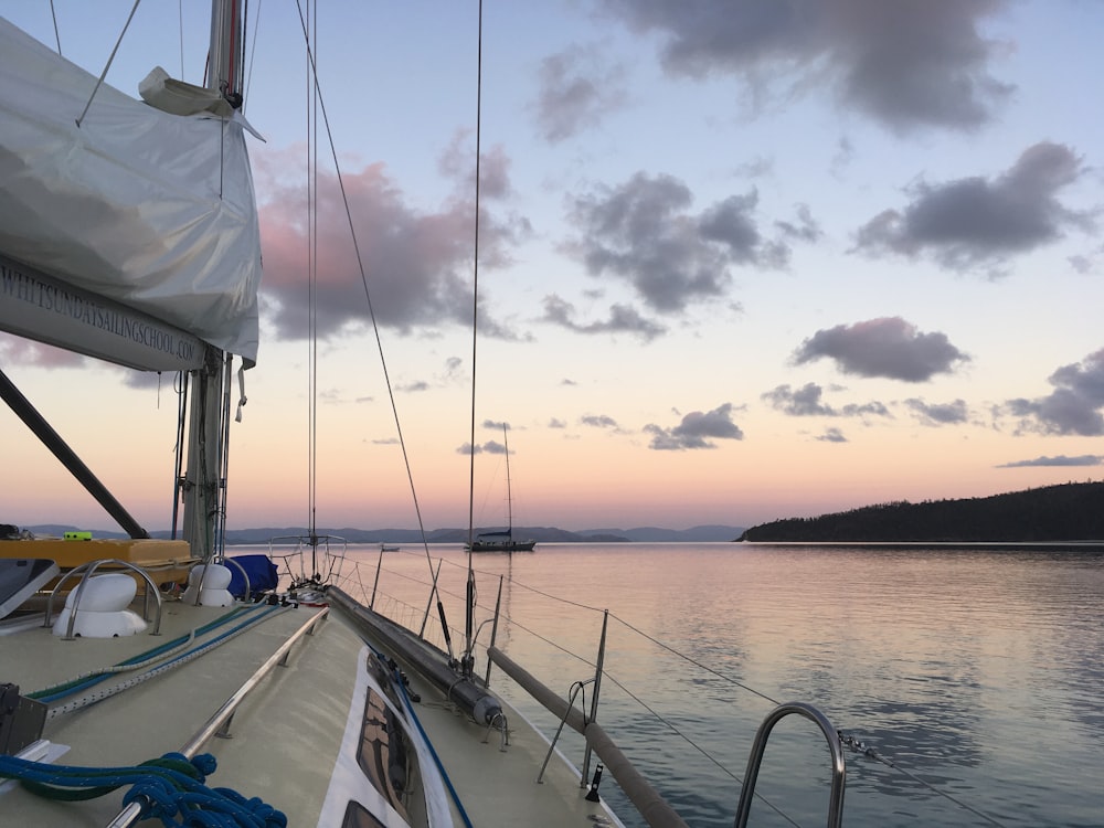 gray boat on calm water