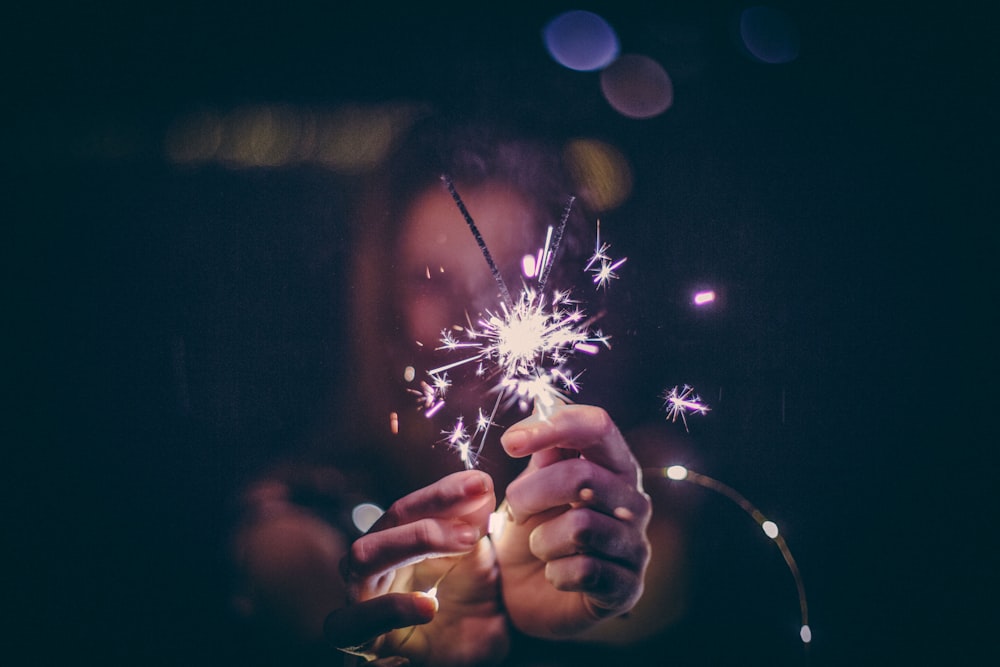 person holding sparks