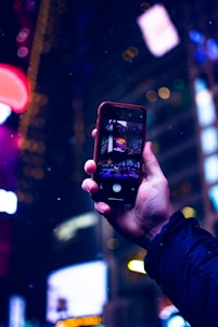A scenic view of a traveler exploring a vibrant city with a digital device.