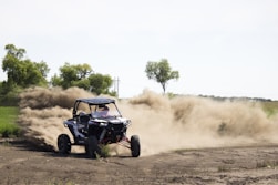 drifting UTV at the field during day