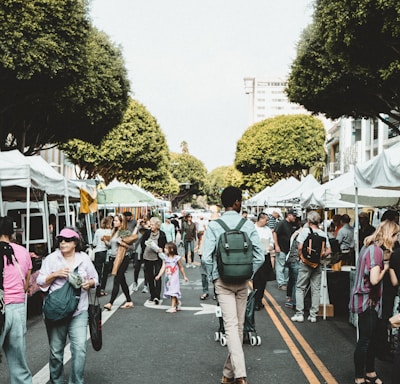 people walking on walkway during daytime