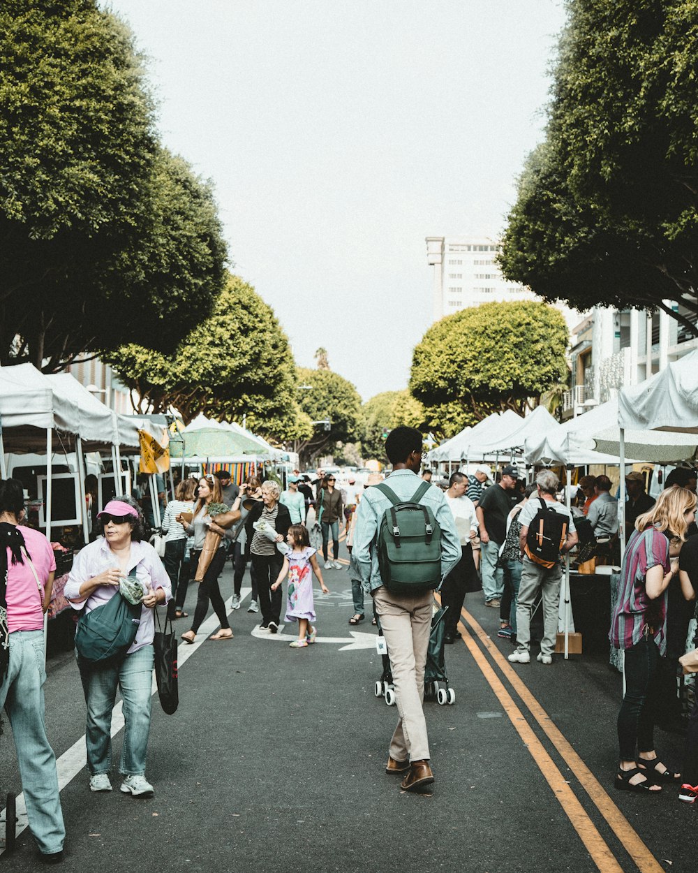 people walking on walkway during daytime