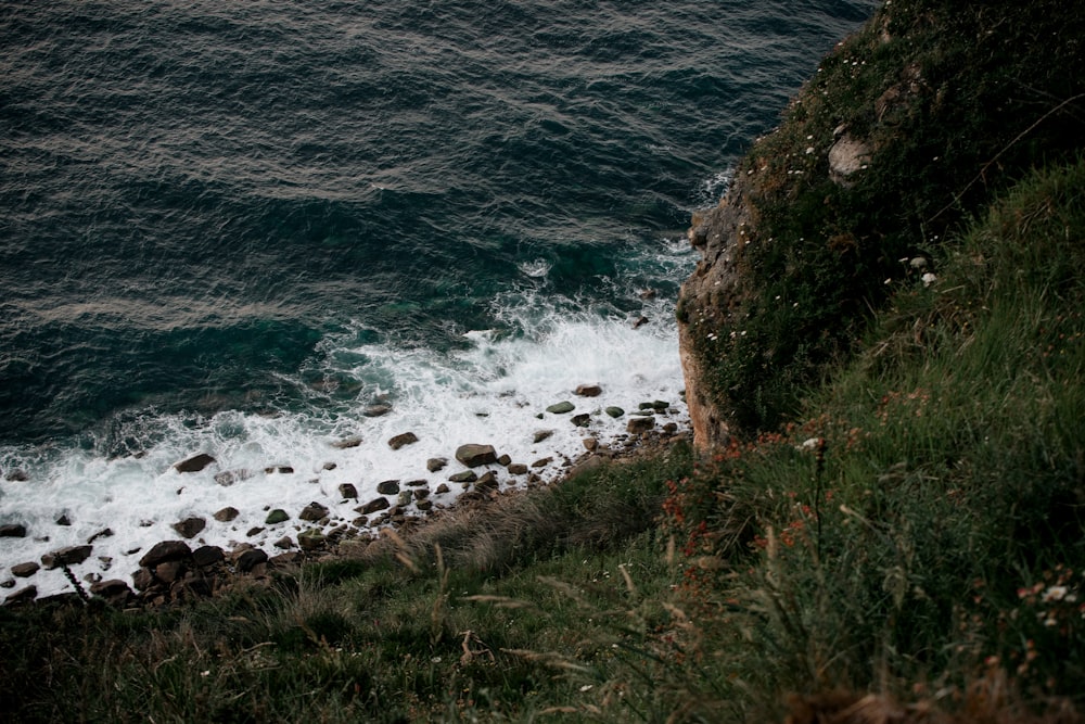 a view of the ocean from the top of a hill