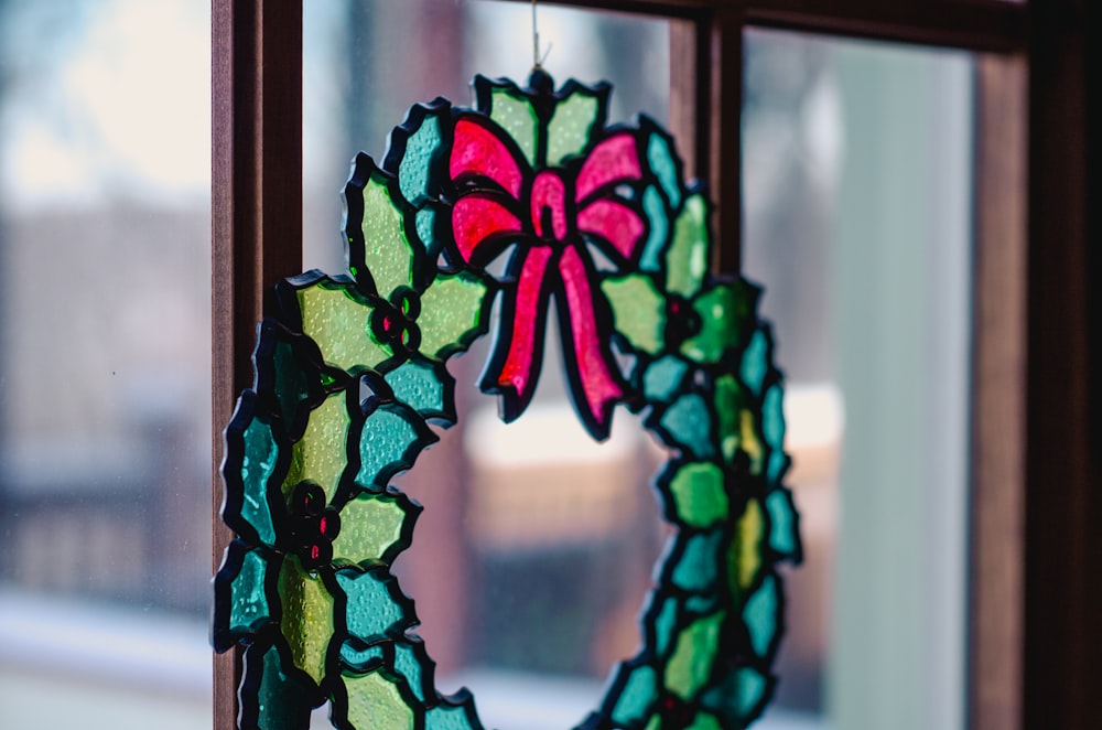 Christmas decor hanging at glass window