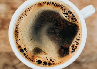 white ceramic mug filled with coffee