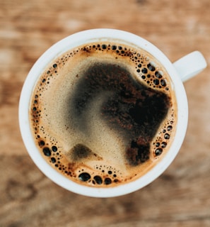 white ceramic mug filled with coffee