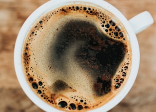 white ceramic mug filled with coffee