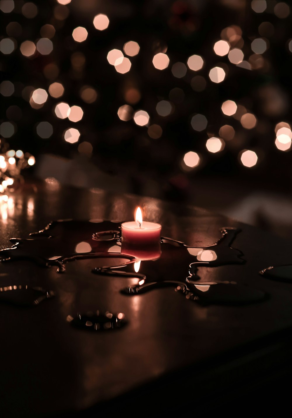 tilt shift lens photography of tealight candle