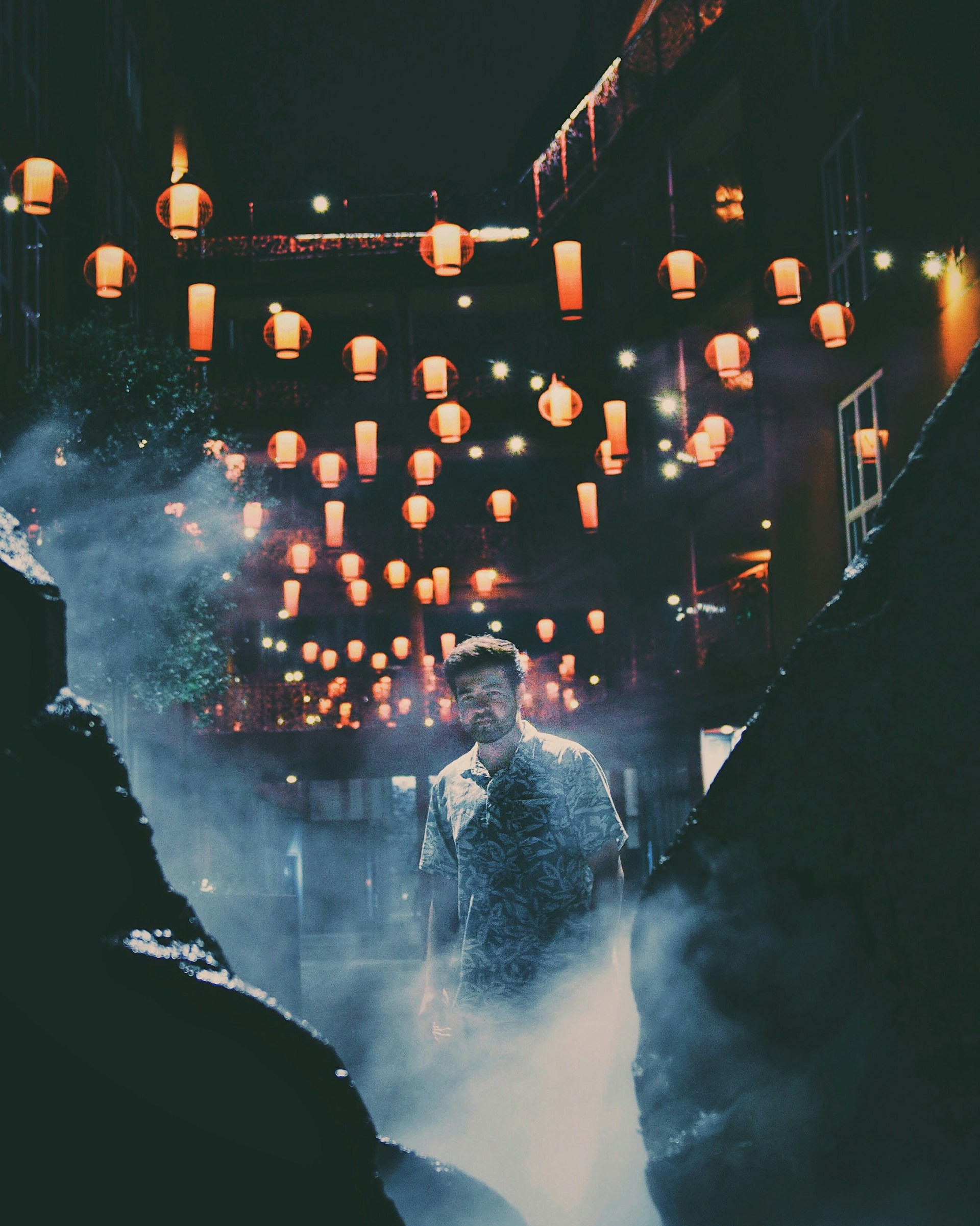 An atmospheric scene of a misty alleyway lit by glowing lanterns, blending fantasy and steampunk elements.